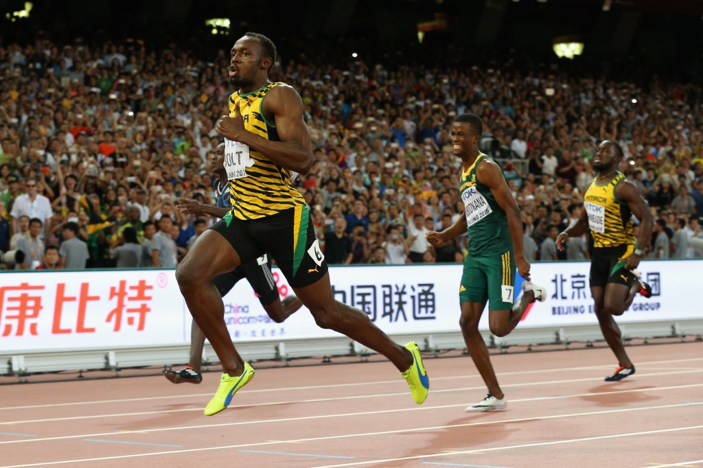 BEIJING, CHINA - AUGUST 27: Usain Bolt of Jamaica crosses the finish line to win gold ahead of Anaso Jobodwana of South Africa (2nd R) in the Men's 200 metres final during day six of the 15th IAAF World Athletics Championships Beijing 2015 at Beijing National Stadium on August 27, 2015 in Beijing, China. (Photo by Andy Lyons/Getty Images)