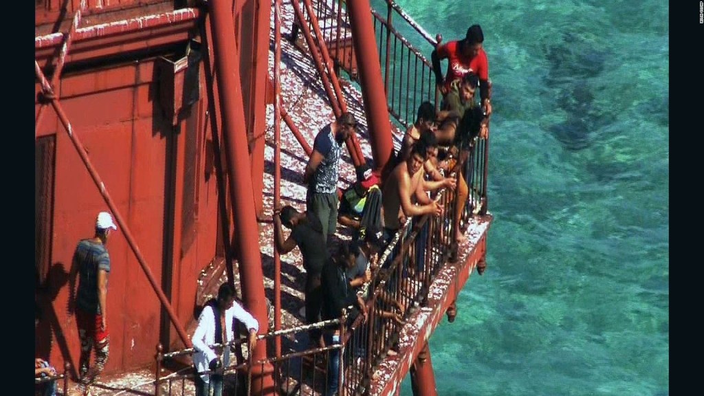 A lawsuit argues the group of migrants who fled Cuba in a homemade boat and climbed onto a 136-year-old lighthouse off the Florida Keys should be allowed to stay in the United States.