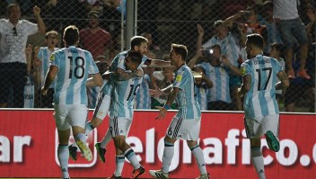 Argentina's Lionel Messi celebrates with teammates after scoring against Colombia during their 2018 FIFA World Cup qualifier football match in San Juan, Argentina, on November 15, 2016. / AFP / Juan Mabromata (Photo credit should read JUAN MABROMATA/AFP/Getty Images)