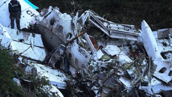 Rescue teams work in the recovery the bodies of victims of the LAMIA airlines charter that crashed in the mountains of Cerro Gordo, municipality of La Union, Colombia, on November 29, 2016 carrying members of the Brazilian football team Chapecoense Real. A charter plane carrying the Brazilian football team crashed in the mountains in Colombia late Monday, killing as many as 75 people, officials said. / AFP / STR / RAUL ARBOLEDA (Photo credit should read RAUL ARBOLEDA/AFP/Getty Images)