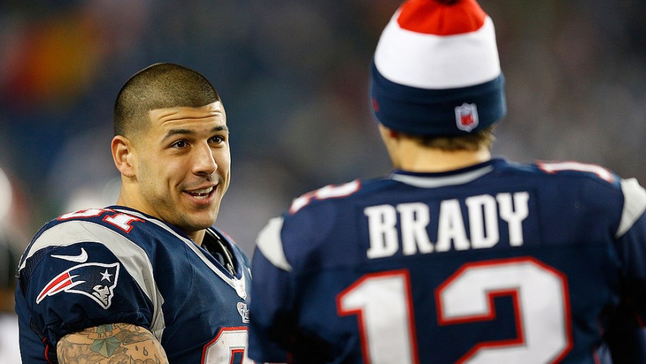 FOXBORO, MA - DECEMBER 10: Tom Brady #12 of the New England Patriots chats with Aaron Hernandez #81 against the Houston Texans at Gillette Stadium on December 10, 2012 in Foxboro, Massachusetts. (Photo by Jim Rogash/Getty Images)
