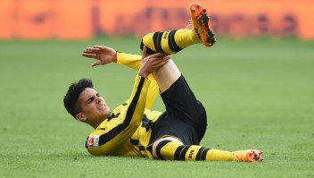 Dortmund's Spanish defender Marc Bartra lays on the pitch during the German first division Bundesliga football match FC Bayern Munich v BVB Borussia Dortmund in Munich, southern Germany, on April 8, 2017. / AFP PHOTO / Christof STACHE / RESTRICTIONS: DURING MATCH TIME: DFL RULES TO LIMIT THE ONLINE USAGE TO 15 PICTURES PER MATCH AND FORBID IMAGE SEQUENCES TO SIMULATE VIDEO. == RESTRICTED TO EDITORIAL USE == FOR FURTHER QUERIES PLEASE CONTACT DFL DIRECTLY AT + 49 69 650050 (Photo credit should read CHRISTOF STACHE/AFP/Getty Images)