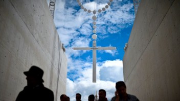 People walk under a giant rosary hanging at Fatima Sanctuary in Fatima, central Portugal, on May 12, 2017. Two of the three child shepherds who reported apparitions of the Virgin Mary in Fatima, Portugal, one century ago, will be declared saints on May 13, 2017 by Pope Francis. The canonisation of Jacinta and Francisco Marto will take place during the Argentinian pontiff's visit to a Catholic shrine visited by millions of pilgrims every year. / AFP PHOTO / PATRICIA DE MELO MOREIRA (Photo credit should read PATRICIA DE MELO MOREIRA/AFP/Getty Images)