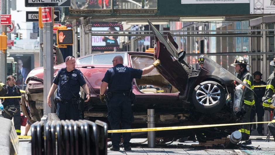 NEW YORK, NY - MAY 18: A wrecked car sits in the intersection of 45th and Broadway in Times Square, May 18, 2017 in New York City. According to reports there were multiple injuries and one fatality after the car plowed into a crowd of people. (Photo by Drew Angerer/Getty Images)