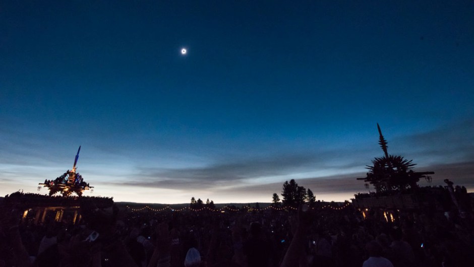 The sun's corona only is visible during a total solar eclipse between the Solar Temples at Big Summit Prairie ranch in Oregon's Ochoco National Forest near the city of Mitchell August 21, 2017. The Sun started to vanish behind the Moon as the partial phase of the so-called Great American Eclipse began Monday, with millions of eager sky-gazers soon to witness "totality" across the nation for the first time in nearly a century. / AFP PHOTO / Robyn Beck (Photo credit should read ROBYN BECK/AFP/Getty Images)