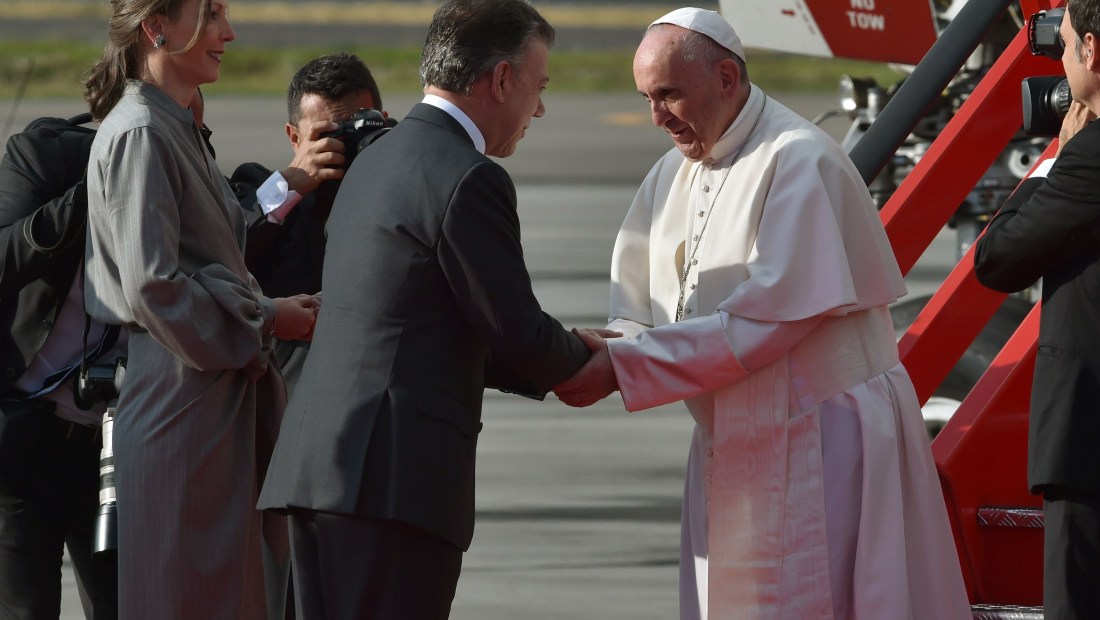 Colombian President Juan Manuel Santos (C) and his wife Maria Clemencia Rodriguez (L) greet Pope Francis upon his arrival to Bogota on September 6, 2017. Pope Francis set off for Colombia on Wednesday for a five-day tour to plead for a "stable and lasting" peace in a divided country just emerging from a 50-year war that claimed hundreds of thousands of lives. / AFP PHOTO / RODRIGO ARANGUA (Photo credit should read RODRIGO ARANGUA/AFP/Getty Images)
