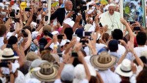 Pope Francis waves from the Popemobile upon arrival at Contecar -Cartagena's maritime terminal- to celebrate an open-air mass during the last day of his visit to Colombia on September 10, 2017. Pope Francis prayed Sunday for a peaceful end to Venezuela's "grave crisis" which has left scores dead, as he wrapped up a tour to support peace in neighboring Colombia. / AFP PHOTO / Alberto PIZZOLI (Photo credit should read ALBERTO PIZZOLI/AFP/Getty Images)