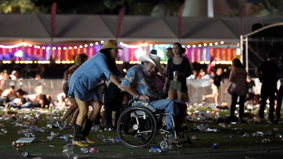 LAS VEGAS, NV - OCTOBER 01: A man in a wheelchair is taken away from the Route 91 Harvest country music festival after apparent gun fire was heard on October 1, 2017 in Las Vegas, Nevada. There are reports of an active shooter around the Mandalay Bay Resort and Casino. (Photo by David Becker/Getty Images)