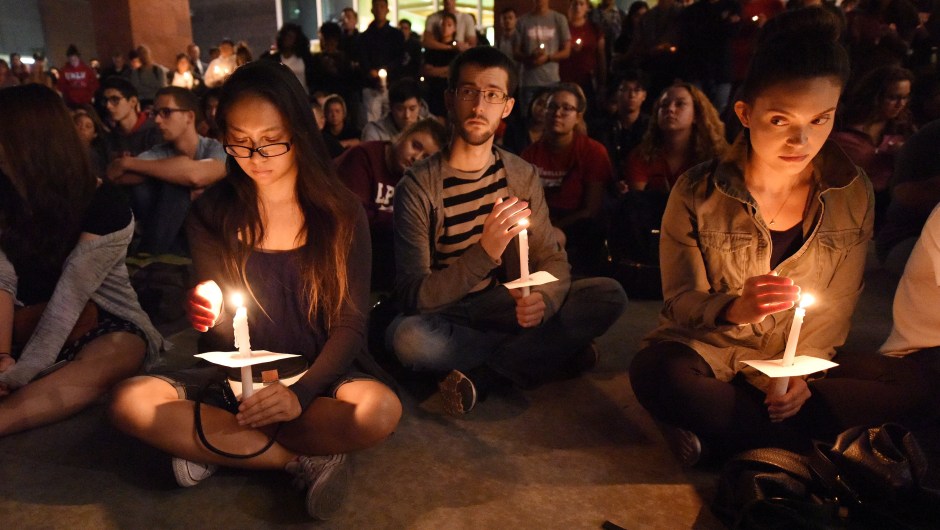 People attend a candlelight vigil at the University of Las Vegas student union October 2, 2017, after a gunman killed at least 58 people and wounded more than 500 others when he opened fire on a country music concert in Las Vegas, Nevada late October 1, 2017. / AFP PHOTO / Robyn Beck (Photo credit should read ROBYN BECK/AFP/Getty Images)