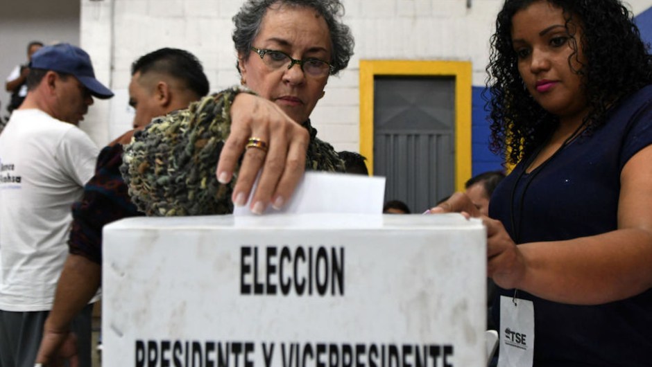 A voter casts her ballot at a polling station in Tegucigalpa during the general election on November 26, 2017. Honduras' six million voters are to cast ballots in a controversial election Sunday in which President Juan Orlando Hernandez is seeking a second mandate despite a constitutional one-term limit. This small country is at the heart of Central America's "triangle of death," an area plagued by gangs and poverty. / AFP PHOTO / ORLANDO SIERRA (Photo credit should read ORLANDO SIERRA/AFP/Getty Images)