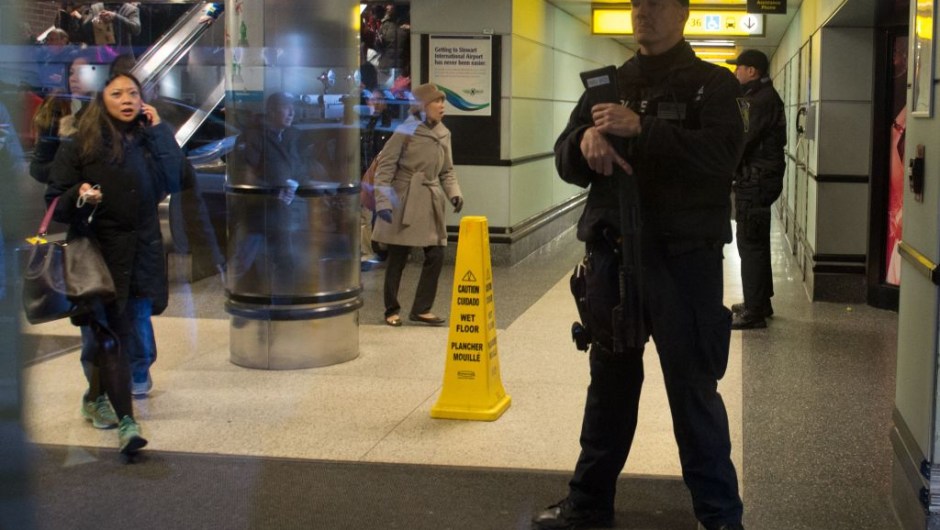 Port Authority Police watch as people evacuate after a reported explosion at the Port Authority Bus Terminal on December 11, 2017 in New York. New York police said Monday that they were investigating an explosion of "unknown origin" in busy downtown Manhattan, and that people were being evacuated. Media reports said at least one person had been detained after the blast near the Port Authority transit terminal, close to Times Square.Early media reports said the blast came from a pipe bomb, and that several people were injured. / AFP PHOTO / Bryan R. Smith (Photo credit should read BRYAN R. SMITH/AFP/Getty Images)