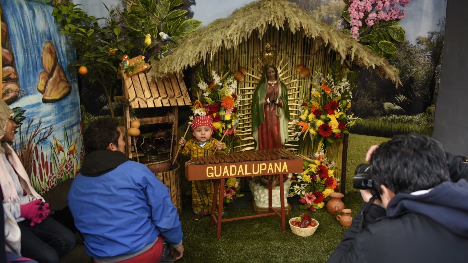 A child dressed as indigenous peasant Juan Diego plays marimba during the celebration of the apparition of the Virgin of Guadalupe to Juan Diego in Mexico in 1531, at the basilica of the Virgin of Guadalupe, in downtown Guatemala City, on December 12, 2017. / AFP PHOTO / Johan ORDONEZ (Photo credit should read JOHAN ORDONEZ/AFP/Getty Images)