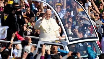 Pope Francis waves at the crowd from the popemobile as he arrives at O'Higgins Park in Santiago on January 16, 2018 to give an open-air mass. The pope landed in Santiago late Monday on his first visit to Chile since becoming pope, and his sixth to Latin America - a trip that will also take him to Peru. / AFP PHOTO / Pablo PORCIUNCULA BRUNE (Photo credit should read PABLO PORCIUNCULA BRUNE/AFP/Getty Images)