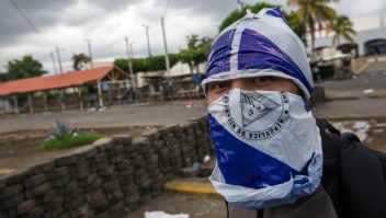 A young peasant who spent the night at the Metropolitan Cathedral in Managua, where he took refuge during deadly clashes within a march marking Nicaragua's National Mothers Day, is pictured after leaving the church on May 31, 2018. - The death toll from weeks of violent unrest in Nicaragua rose to almost 100 as embattled President Daniel Ortega rejected calls to step down and the Catholic church, which has tried to mediate the conflict, Thursday refused to resume the dialogue. (Photo by INTI OCON / AFP) (Photo credit should read INTI OCON/AFP/Getty Images)