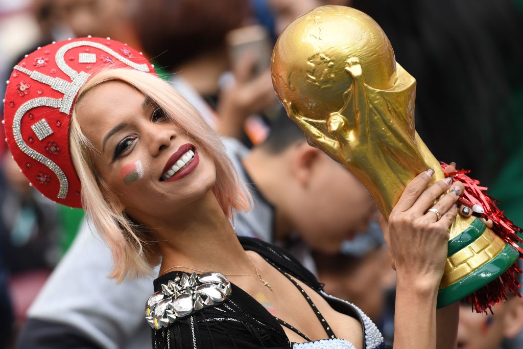 A Russian fan holds a replica of the FIFA 2018 World Cup trophy before the Russia 2018 World Cup Group A football match between Russia and Saudi Arabia at the Luzhniki Stadium in Moscow on June 14, 2018. (Photo by Kirill KUDRYAVTSEV / AFP) / RESTRICTED TO EDITORIAL USE - NO MOBILE PUSH ALERTS/DOWNLOADS (Photo credit should read KIRILL KUDRYAVTSEV/AFP/Getty Images)