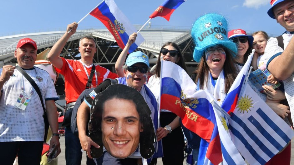Uruguay and Russia supporters pose with a cardboard cutout of Urugay's forward Edinson Cavani outside the Samara Arena in Samara on June 25, 2018, prior to the Russia 2018 World Cup Group A football match between Uruguay and Russia. (Photo by EMMANUEL DUNAND / AFP) / RESTRICTED TO EDITORIAL USE - NO MOBILE PUSH ALERTS/DOWNLOADS (Photo credit should read EMMANUEL DUNAND/AFP/Getty Images)