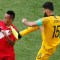 TOPSHOT - Australia's midfielder Mile Jedinak (R) fouls Peru's midfielder Christian Cueva during the Russia 2018 World Cup Group C football match between Australia and Peru at the Fisht Stadium in Sochi on June 26, 2018. (Photo by Odd ANDERSEN / AFP) / RESTRICTED TO EDITORIAL USE - NO MOBILE PUSH ALERTS/DOWNLOADS (Photo credit should read ODD ANDERSEN/AFP/Getty Images)