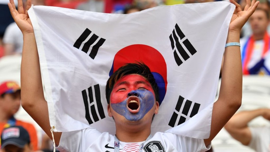 South Korea's fan cheers prior to the Russia 2018 World Cup Group F football match between South Korea and Germany at the Kazan Arena in Kazan on June 27, 2018. (Photo by SAEED KHAN / AFP) / RESTRICTED TO EDITORIAL USE - NO MOBILE PUSH ALERTS/DOWNLOADS (Photo credit should read SAEED KHAN/AFP/Getty Images)