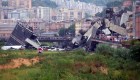 TOPSHOT - A picture taken on August 14, 2018 in Genoa shows a section of a giant motorway bridge that collapsed earlier injuring several people. - Rescuers scouring through the wreckage after part of a viaduct of the A10 freeway collapsed said there were "tens of victims", while images from the scene showed an entire carriageway plunged on to railway lines below. (Photo by Andrea LEONI / AFP) (Photo credit should read ANDREA LEONI/AFP/Getty Images)