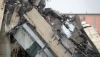 Rescuers are at work amid the rubble of a section of a giant motorway bridge that collapsed earlier, on August 14, 2018 in Genoa. - Rescuers scouring through the wreckage after part of a viaduct of the A10 freeway collapsed said there were "tens of victims", while images from the scene showed an entire carriageway plunged on to railway lines below. (Photo by ANDREA LEONI / AFP) (Photo credit should read ANDREA LEONI/AFP/Getty Images)