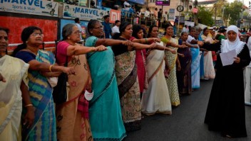 Women take pledge to fight gender discrimination as they form part of a 620 kilometers (388 miles) long 'women's wall' in Thiruvanathapuram, Kerala, India,Tuesday, Jan.1, 2019. The wall was organized in the backdrop of conservative protestors blocking the entry of women of menstruating age at the Sabarimala temple, one of the world's largest Hindu pilgrimage sites defying a recent ruling from India???s top court to let them enter. (AP Photo/R S Iyer)