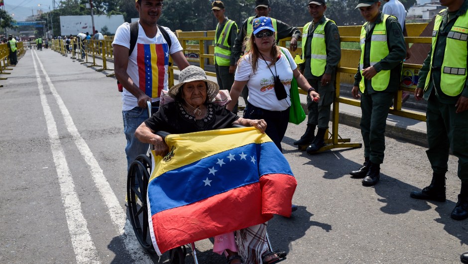 Venezuelans cross the Simon Bolivar International Brige from San Antonio del Tachira in Venezuela, to attend the "Venezuela Aid Live" concert on the Colombian side of Tienditas International Bridge in Cucuta, Colombia on February 22, 2019. - Thousands of people, many waving Venezuelan flags, streamed into a concert site on the Venezuela-Colombia border Friday for an international charity concert to push for humanitarian aid deliveries in defiance of a blockade by the government of President Nicolas Maduro. (Photo by Federico Parra / AFP) (Photo credit should read FEDERICO PARRA/AFP/Getty Images)