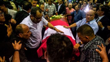 The coffin with the remains of late Peruvian former President Alan Garcia arrives to the American Popular Revolutionary Alliance (APRA) party headquarter's in Lima, on April 17, 2019. - Garcia, who was president from 1985-90 and again from 2006-11, died in hospital on April 17, 2019, after shooting himself in the head at his home as police were about to arrest him over the graft investigation. He was suspected of having taken bribes from Brazilian construction giant Odebrecht in return for large-scale public works contracts. (Photo by ERNESTO BENAVIDES / AFP) (Photo credit should read ERNESTO BENAVIDES/AFP/Getty Images)