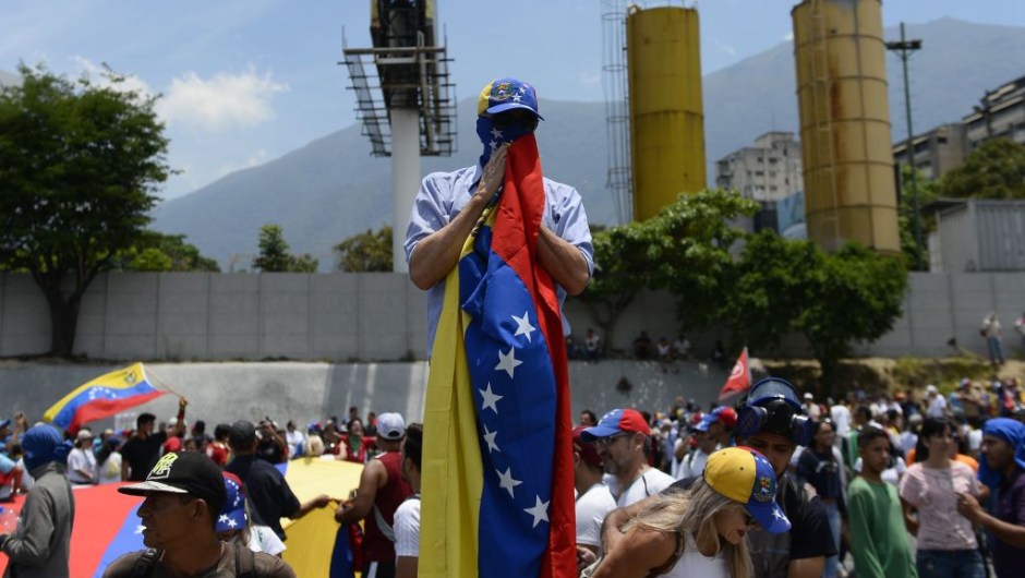 Anti-government demonstrators rally in Caracas to commemorate May Day on May 1, 2019 after a day of violent clashes on the streets of the capital spurred by Venezuelan opposition leader Juan Guaido's call on the military to rise up against President Nicolas Maduro. - Guaido called for a massive May Day protest to increase the pressure on President Maduro. (Photo by Matias Delacroix / AFP) (Photo credit should read MATIAS DELACROIX/AFP/Getty Images)