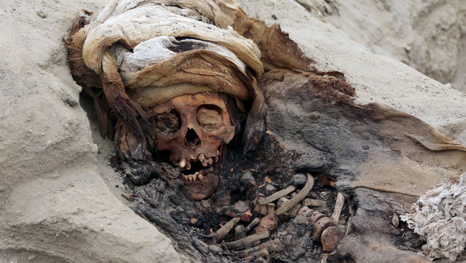 Undated picture released by Andina Agency of the remains of one of 227 children allegedly offered in a sacrifice ritual by the pre-Columbian culture Chimu, uncovered by archaeologists in the Pampa La Cruz sector in Huanchaco, a coastal municipality of Trujillo, 700 km north of Lima. - A group of archeologists have discovered the remains of 227 children on Peru's north coast that were ritually sacrificed during the pre-Columbian Chimu culture, the biggest ever discovery of child sacrifice in the world. (Photo by LUIS PUELL / ANDINA / AFP) / RESTRICTED TO EDITORIAL USE - MANDATORY CREDIT "AFP PHOTO / ANDINA / PROGRAMA ARQUEOLOGICO HUANCHACO / LUIS PUELL " - NO MARKETING NO ADVERTISING CAMPAIGNS - DISTRIBUTED AS A SERVICE TO CLIENTSLUIS PUELL/AFP/Getty Images