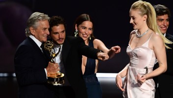 (From L) Michale Douglas, British actor Kit Harington, British actress Emilia Clarke and British actress Sophie Turner gesture as cast and crew of "Game of Thrones" accepts the Outstanding Drama Series award onstage during the 71st Emmy Awards at the Microsoft Theatre in Los Angeles on September 22, 2019. (Photo by Frederic J. BROWN / AFP) (Photo credit should read FREDERIC J. BROWN/AFP/Getty Images)
