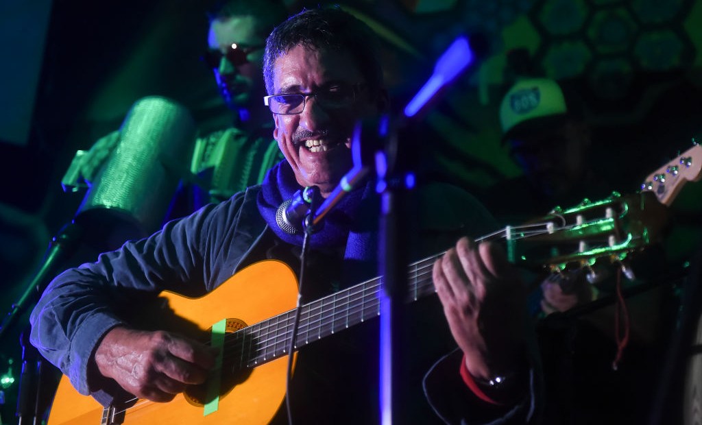 Colombia's FARC member and singer Julian Conrado performs in a bar during the show "Fiesta por la Paz" (Party for Peace) in Bogota, Colombia on May 1, 2017. / AFP PHOTO / RAUL ARBOLEDA (Photo credit should read RAUL ARBOLEDA/AFP/Getty Images)