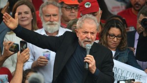 Former Brazilian President Luiz Inacio Lula da Silva speaks to supporters next to his gilfriend Rosangela da Silva (R) after leaving the Federal Police Headquarters, where he was serving a sentence for corruption and money laundering, in Curitiba, Parana State, Brazil, on November 8, 2019. - A judge in Brazil on Friday authorized the release of ex-president Luiz Inacio Lula da Silva, after a Supreme Court ruling paved the way for thousands of convicts to be freed. (Photo by CARL DE SOUZA / AFP) (Photo by CARL DE SOUZA/AFP via Getty Images)