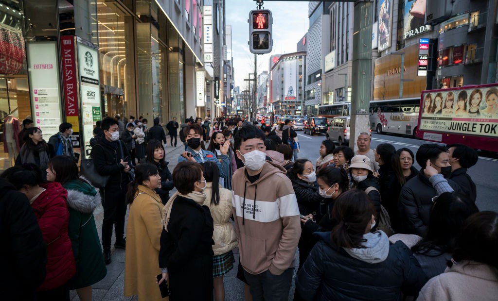 TOKYO, JAPAN - JANUARY 24: Chinese tourists wearing masks walk through the Ginza shopping district on January 24, 2020 in Tokyo, Japan. While Japan is one of the most popular foreign travel destinations for Chinese tourists during the Lunar New Year holiday this year, Japan reported two cases of Wuhan coronavirus infections as the number of those who have died from the virus in China climbed to 25 on Friday and cases have been reported in other countries including the United States, Thailand, Taiwan, Vietnam, Singapore and South Korea. (Photo by Tomohiro Ohsumi/Getty Images)