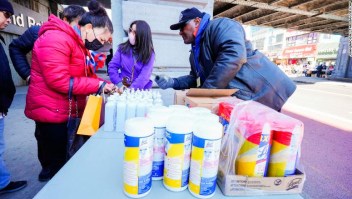 Photo by: John Nacion/STAR MAX/IPx 2020 3/4/20 People wear protective masks to fend off the Corona Virus, while street vendors pedal masks, hand sanitizer and other disinfecting products in Queens, New York.
