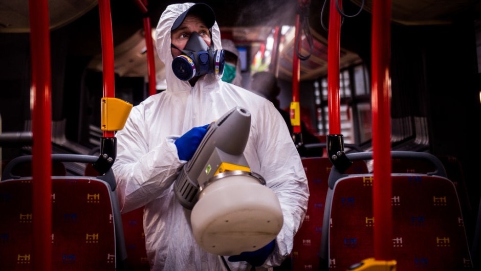 TOPSHOT - A worker wearing protective clothes disinfects an interior of a public bus in a bus-wash station at Transport Company of Bratislava city as part of precautionary measures against the spread of the new coronavirus COVID-19 in Bratislava, Slovakia on March 11, 2020. - Many schools were closed and public events were cancelled due to the coronavirus outbreak in Slovakia as first seven cases of infection were confirmed. (Photo by VLADIMIR SIMICEK / AFP) (Photo by VLADIMIR SIMICEK/AFP via Getty Images)